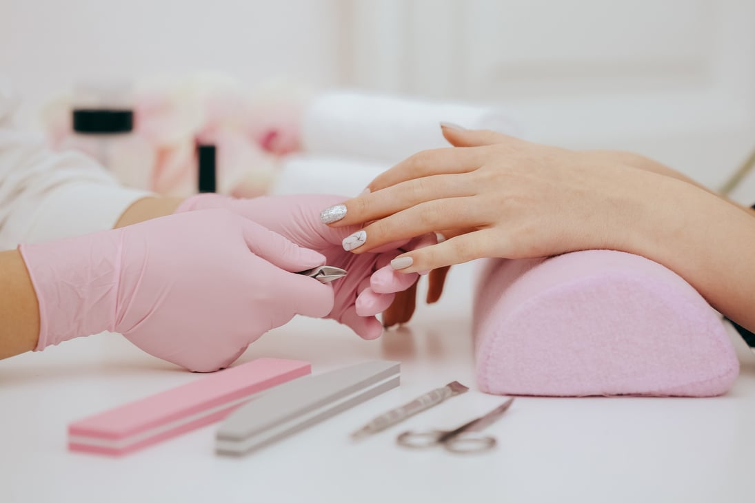 Manicurist does manicure